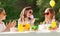 Happy kids with cake on birthday party at summer