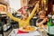 Happy kids eating hamburger with french fries and pizza