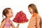 Happy kids eating tasty ripe strawberries