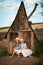 Happy kids having fun hiding in a fantasy wooden playhouse