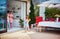 Happy kids helping mother to lay up the table at the summer patio, family lifestyle