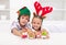 Happy kids holding decorated gingerbread people