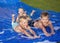 Happy kids playing on a slip and slide outdoors