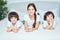 Happy kids. Portrait of teenage latin girl and two little boys smiling at camera. Sister spending time with her cute