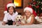 Happy kids and their pets celebrating Christmas