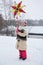 Happy kids in traditional Ukrainian dresses during Christmas holidays