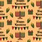 Happy Kwanzaa seamless pattern background in Modern flat style with Kinara candle holder, corn, gift box, text. Vector