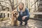 Happy Labradoodle Dog and woman outside at the park