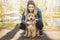 Happy Labradoodle Dog and woman outside at the park