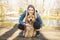 Happy Labradoodle Dog and woman outside at the park