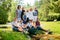 Happy large family posing in scenic summer park