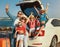 Happy large family  in summer auto journey travel by car on beach