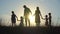 Happy large family at sunset.