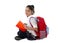 Happy latin school little girl reading textbook or notepad smiling sitting on the floor