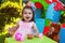 Happy laughing baby toddler girl playing in outdoor tea party with best friend Teddy Bear
