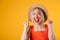 Happy laughing young blonde woman in straw hat. Warm summer mood bright colors