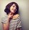 Happy laughing young short hairstyle woman in fashion blouse touching neck