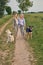 Happy laughing young women walking their dogs