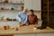 Happy LGBTQ couple lovers cooking together on home kitchen