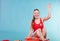 Happy lifeguard woman sitting on rescue ring buoy.