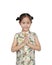 Happy little Asian kid girl wearing cheongsam with greeting gesture celebration for Chinese New Year