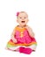 happy little baby girl in bright multicolored festive dress isolated