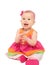 happy little baby girl in bright multicolored festive dress isolated