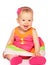 happy little baby girl in bright multicolored festive dress isolated