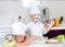 Happy little boy and girl baking in the kitchen