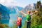 Happy little boy and girl travel in nature, family hiking