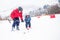 Happy little boy learning skiing with his father in Kitzbuhel ski resort, Tyrol, Austria