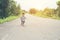 Happy little boy in motion, smiley running on the street.