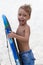 Happy little boy with surfing board