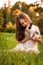 Happy little child girl with cute rabbit. Portrait of kid with pet