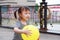 Happy little cute lovely girl Chinese child smile laugh play colorful balloon have fun at summer park nature happiness childhood