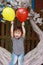 Happy little cute lovely girl Chinese child smile laugh play red balloon have fun at summer park nature happiness childhood