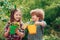 Happy little farmers having fun on field. Brother and sister playing together in the garden. Happy Valentines day.