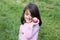 Happy little girl with an apple