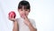 Happy little girl with apple. Cute Asian little girl eating organic apple on white background in studio. Healthy nutrition for sma