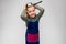 happy little girl in apron playing with saucepan