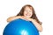 Happy little girl with big fitness ball.