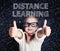 Happy little girl on blackboard background with math and art pattern. Distance learning and creativity education concept