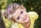 Happy little girl.Child outdoor closeup smiling face.