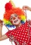 Happy little girl with clown costume