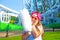 Happy little girl eating cotton candy outdoor