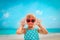 Happy little girl having fun on beach vacation