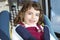 Happy little girl inside car security chair