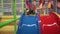 Happy little girl moving down slide on playground in children`s center