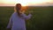 Happy little girl playing with a paper airplane outdoors during sunset. Concept big child dream.