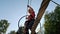 Happy Little Girl Playing in Tarzan Attraction on Playground in Amusement Park